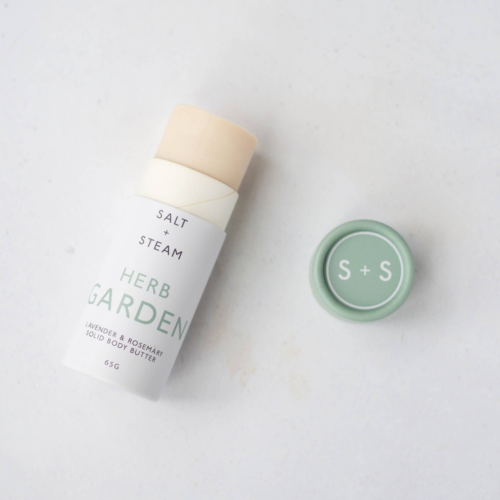 Herb Garden lavender rosemary solid body butter tube on eco-friendly background