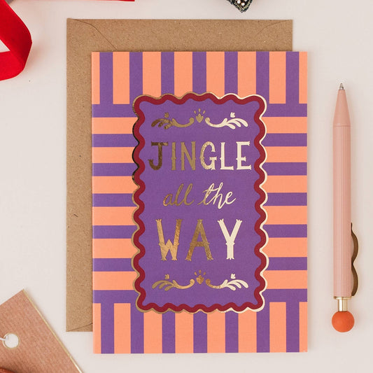 Close-up of Gold Foil and Colourful Stripe Pattern on Jingle All The Way Christmas Card