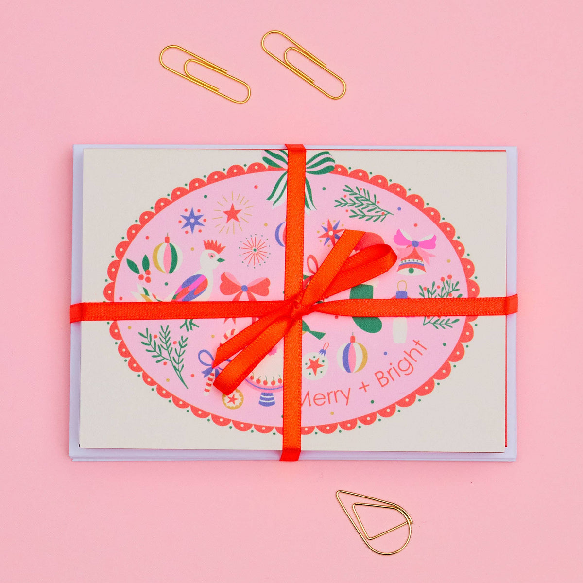 Eight unique Christmas notecard designs tied with a satin ribbon