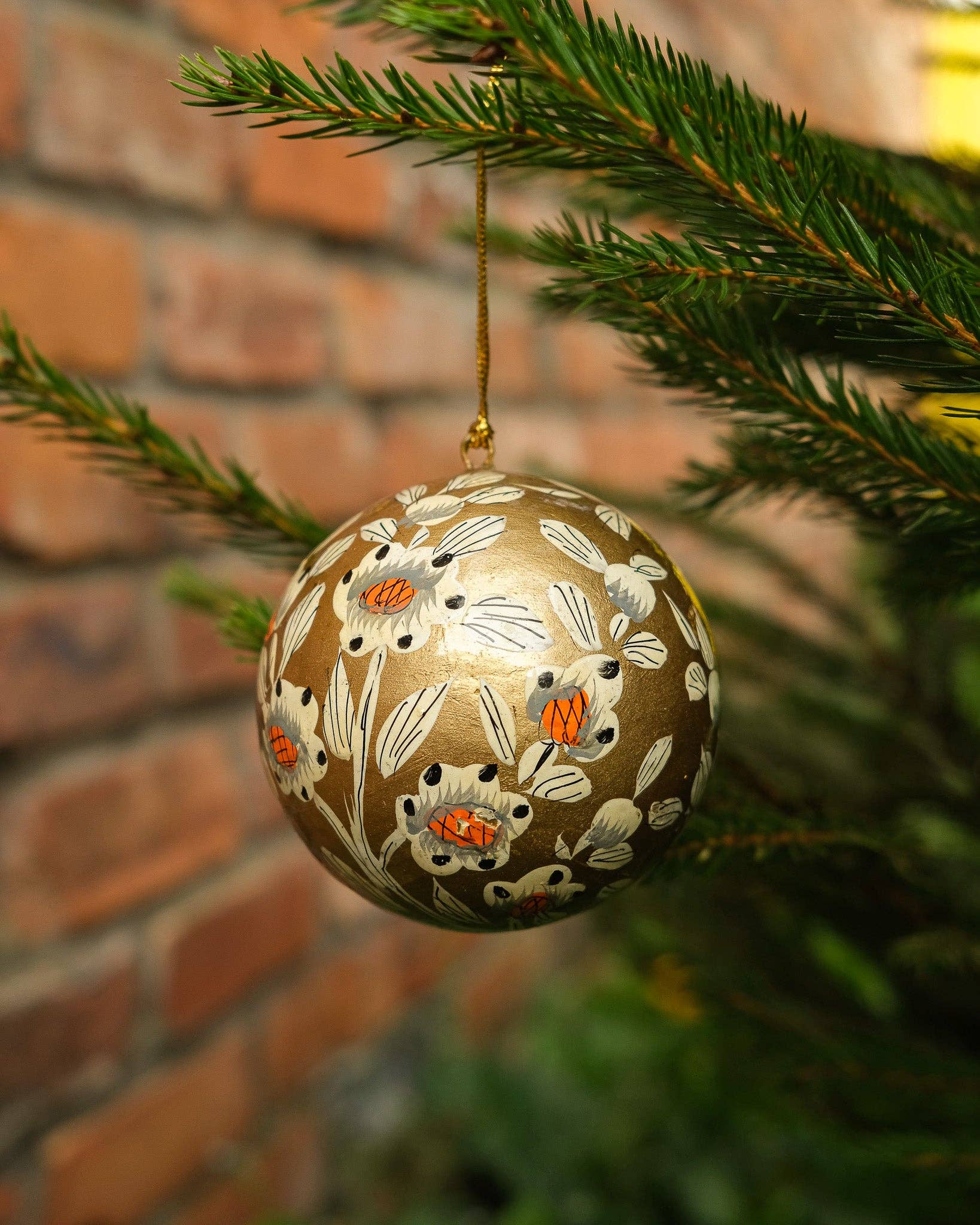 Hand-painted Gold and White Bauble by East End Press made of recycled papier mâché with velvet hanging loop