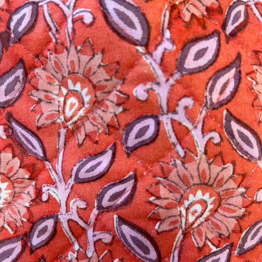Artisan handmade cotton hot water bottle in coral and lilac
