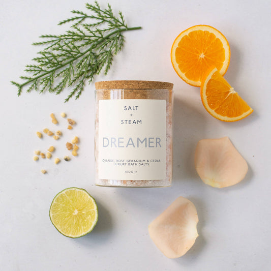 Floral and woody scented vegan bath salts in plastic-free packaging.