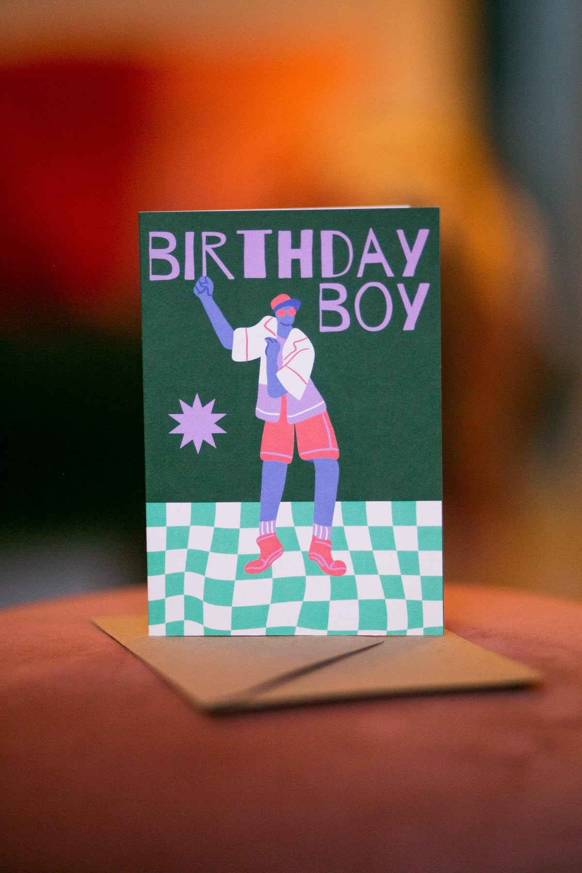 Funky colourful male birthday card with checkered pattern and dancing figure
