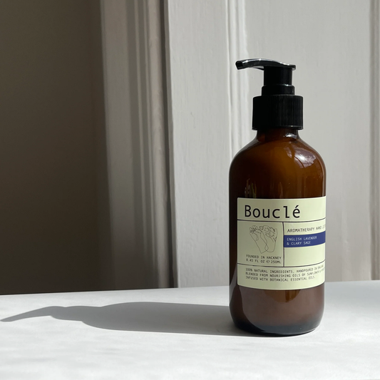 Natural ingredients hand lotion close up showing the elegant amber glass packaging