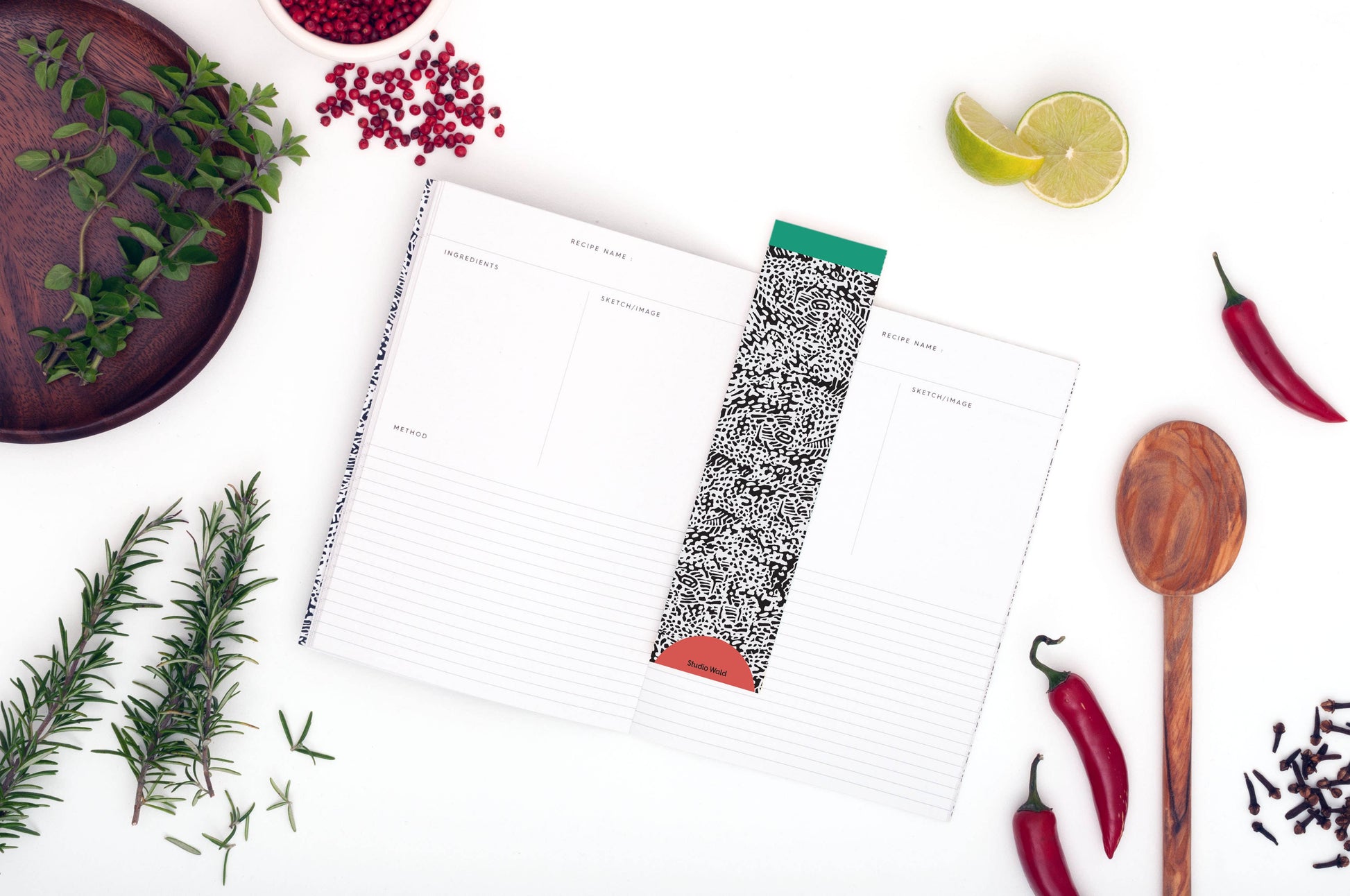 Studio Wald's Recipe Journal features a rosemary and lemon patterned cover design. Pages are designed to layout ingredients and method as well as space to draw pictures, staple photos etc. Also includes a namesake page and handy weights and measurements page at the back.