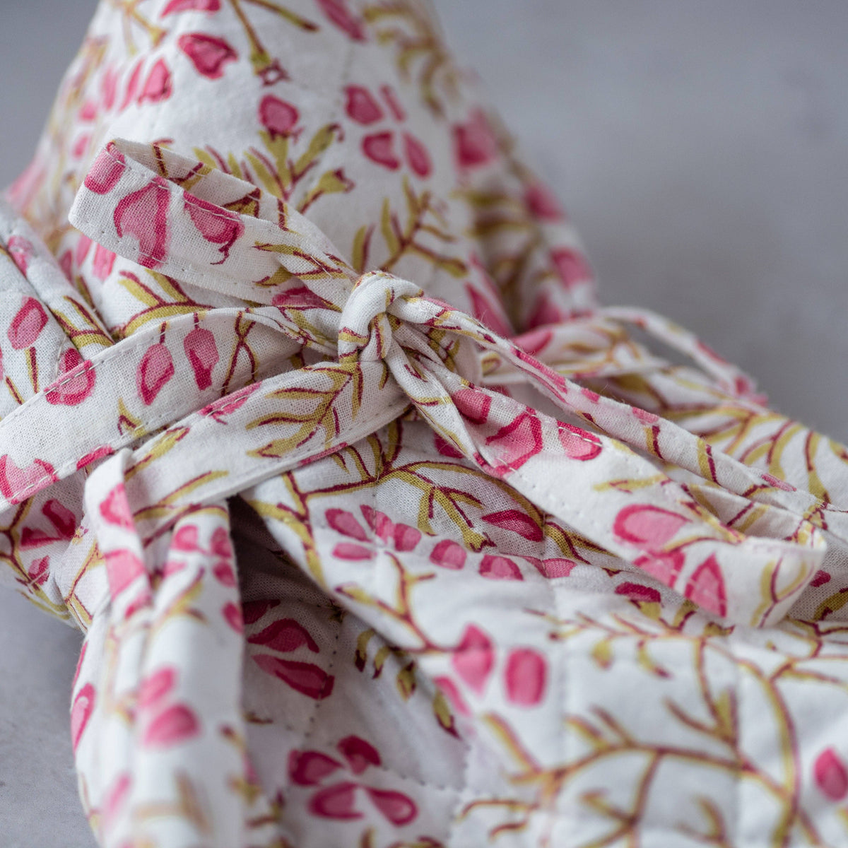 Sustainable cotton hot water bottle in trailing pink flower design