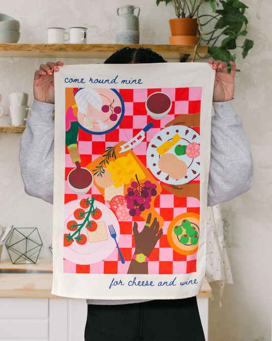 Cheese and wine checkered cotton tea towel with diverse characters