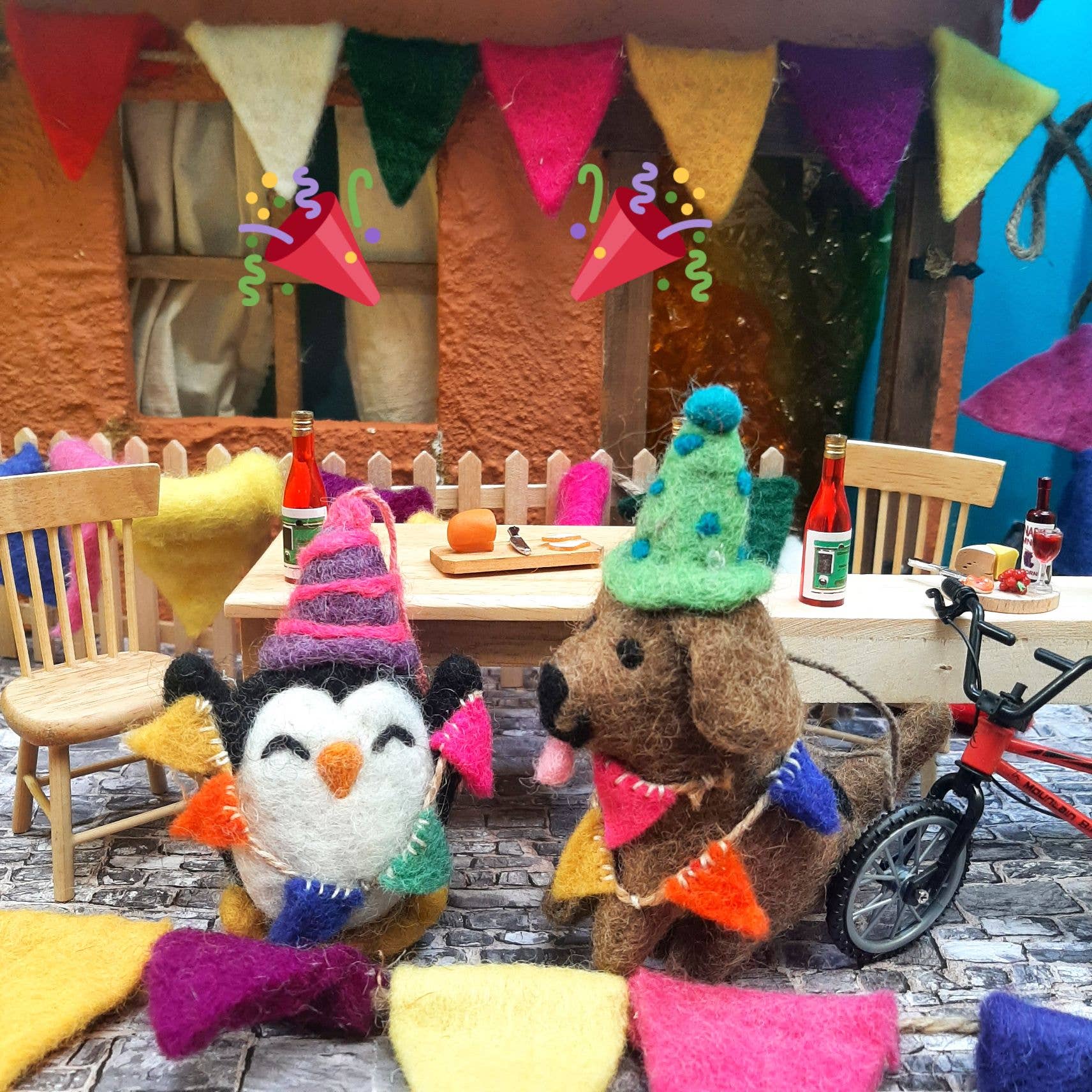 Handmade felt Party Pooch hanging dog decoration by Felt So Good, eco-friendly wool dog with multicoloured bunting and green spotted party hat