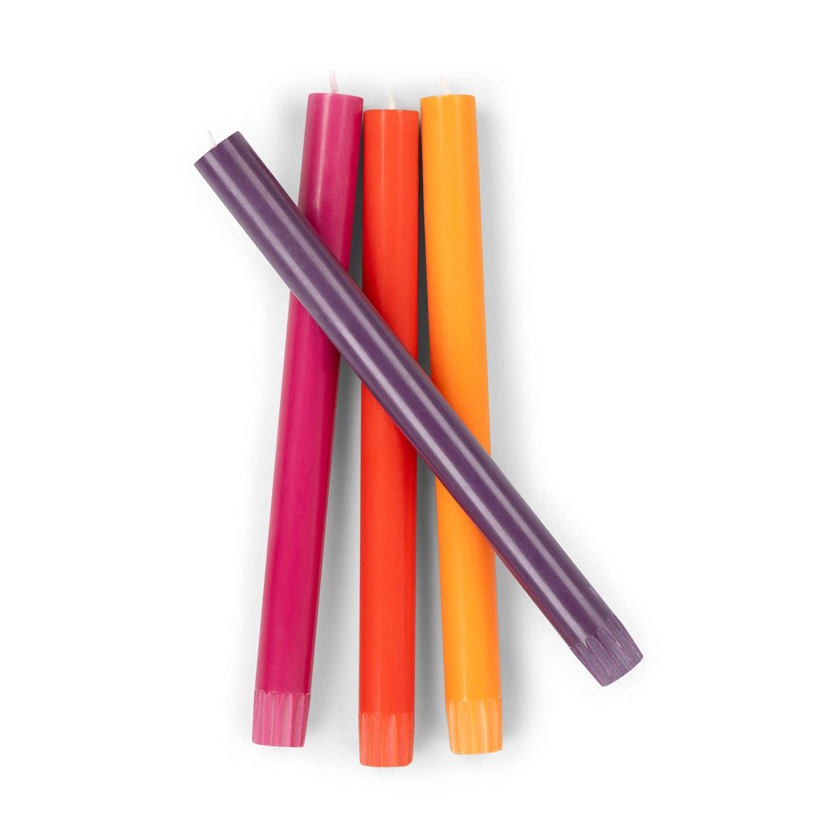 Eco-friendly colourful dinner candles in red, pink, and orange