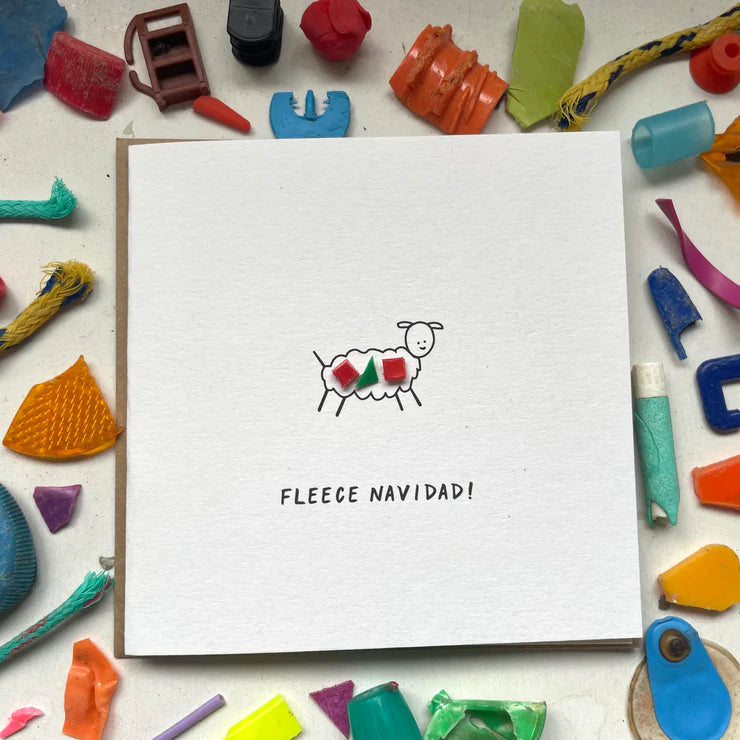 Eco-friendly 'Fleece Navidad' Christmas card with unique microplastic art and sheep design