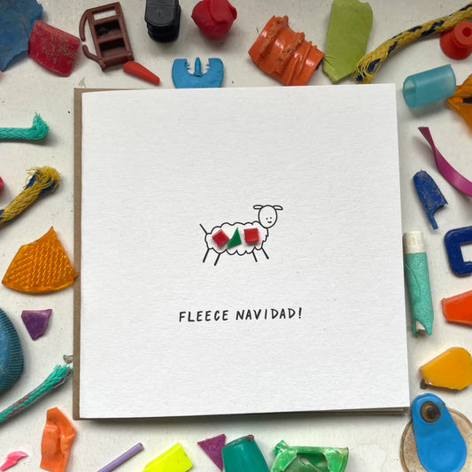 Eco-friendly 'Fleece Navidad' Christmas card with unique microplastic art and sheep design