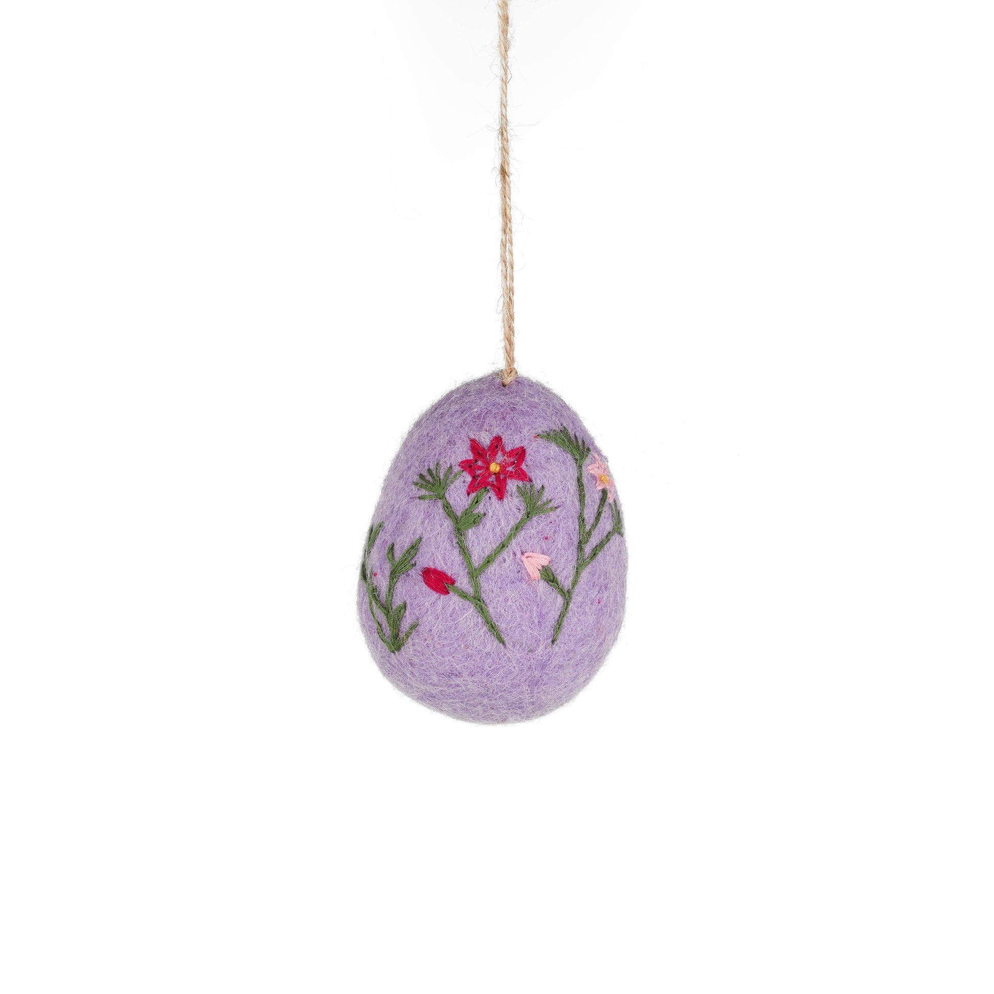 Lilac hand embroidered felt egg featuring delicate floral embroidery. Each egg is meticulously hand stitched, showcasing intricate details and vibrant colours that will add a touch of elegance to your home.