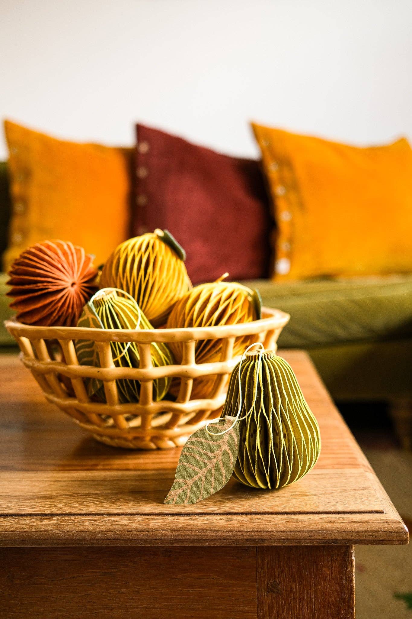 Pear honeycomb ornament styled with other eco-friendly home decorations