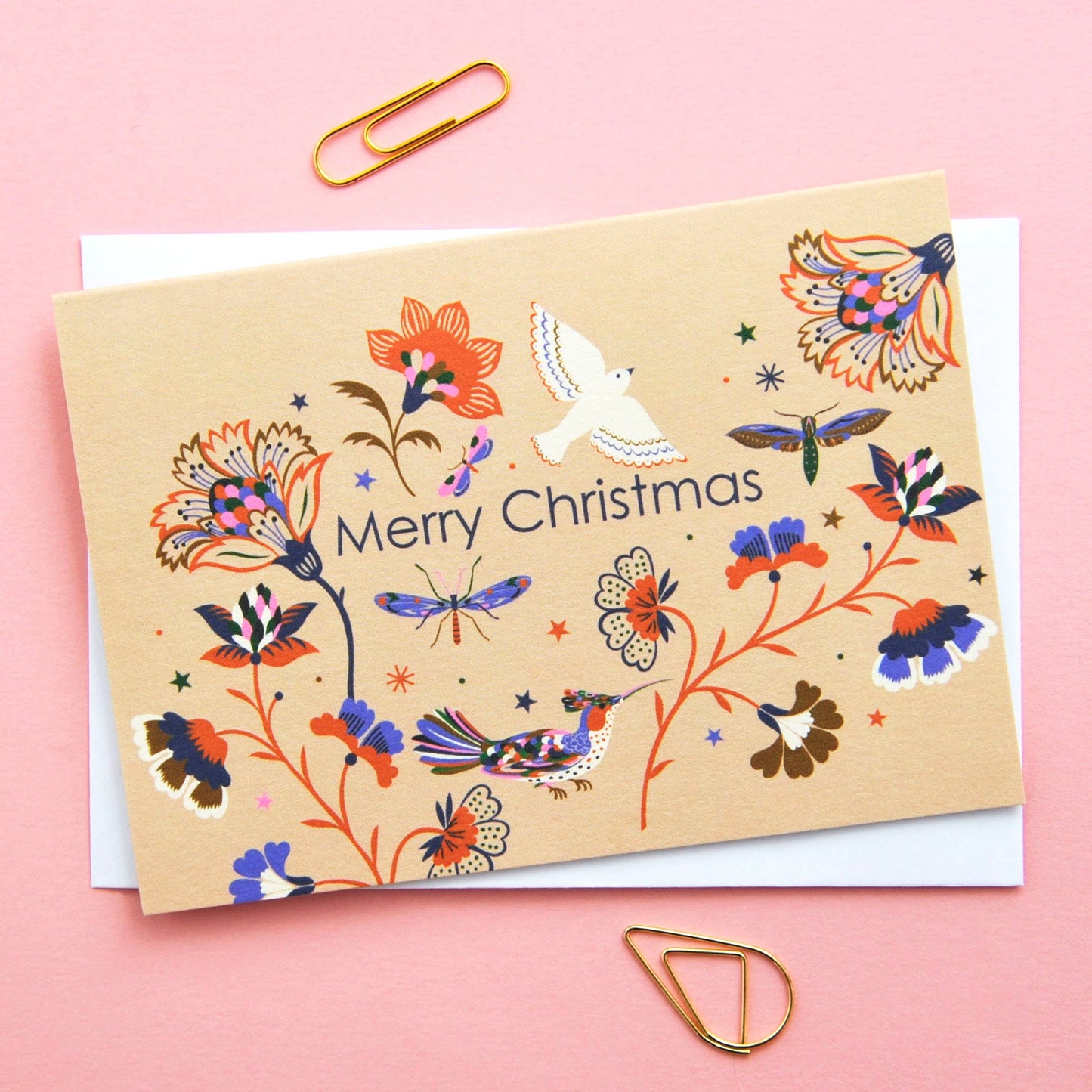 Festive Christmas notecard with colourful flora and fauna illustration on a neutral background, 'Merry Christmas' text.