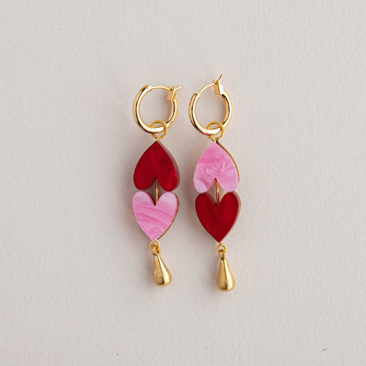 Close up of gold plated brass hoop earrings