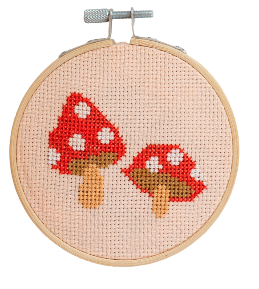 Contents of Red Toadstool Cross Stitch Kit: fabric, thread, needle, instructions