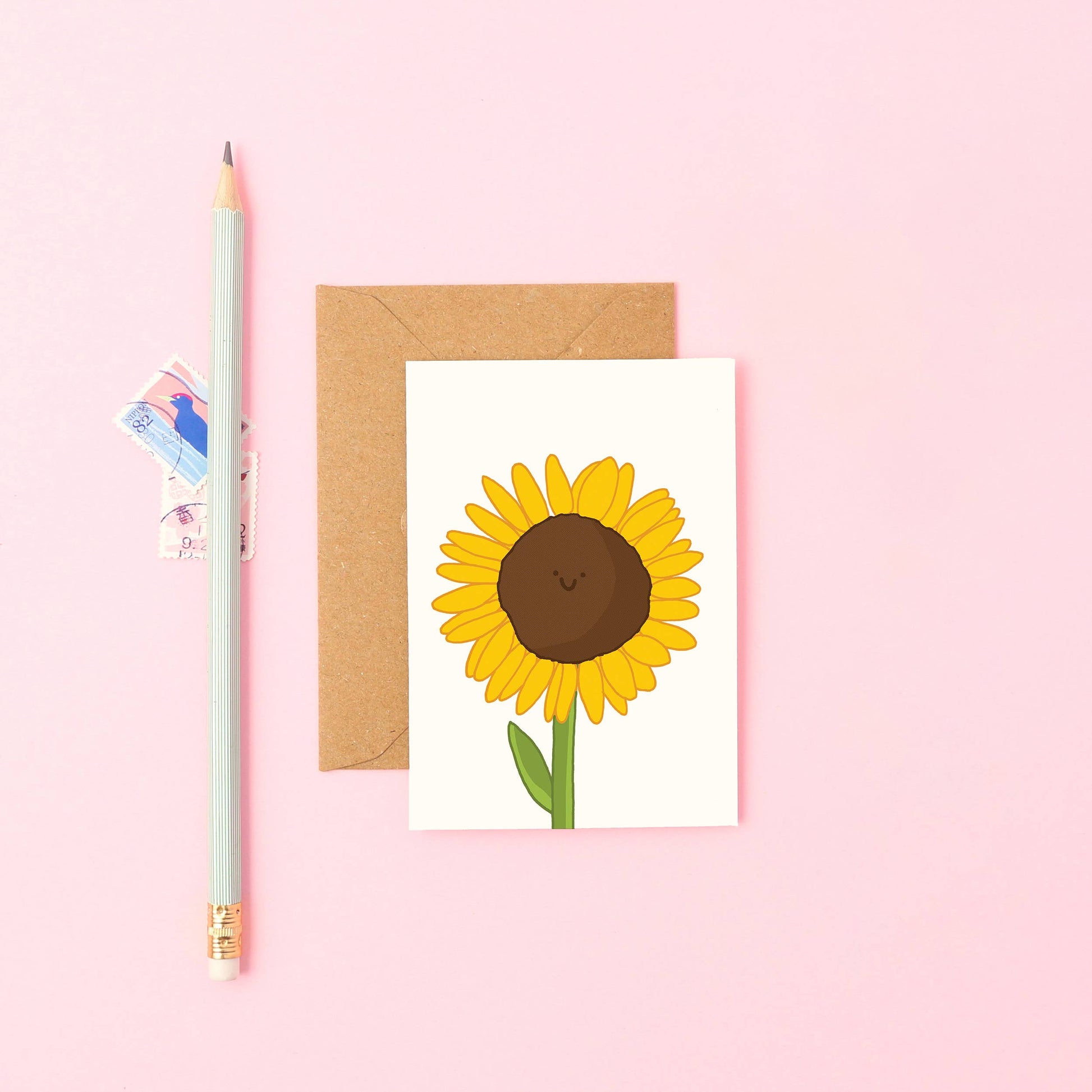 Hand-drawn sunflower mini greeting card—bright, smiling floral design, A7 size, sustainable UK card with a recycled Kraft envelope.