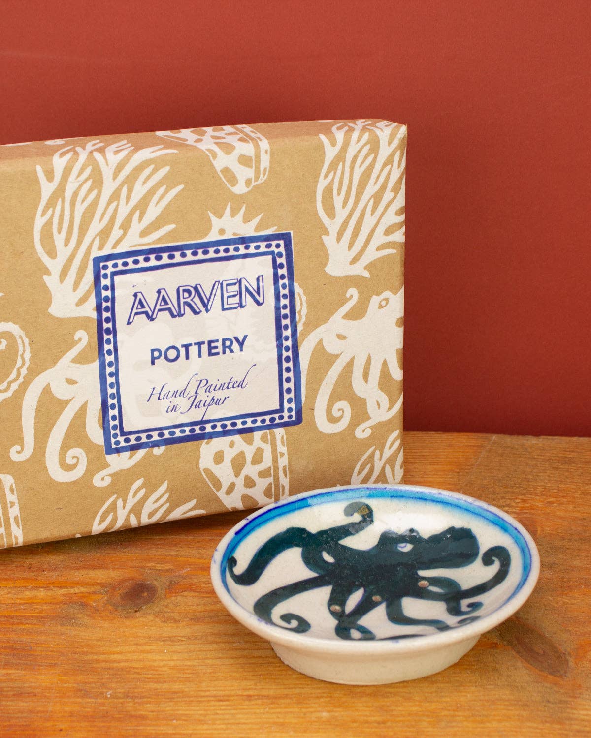 Close up of hand painted blue bird design on soap dish