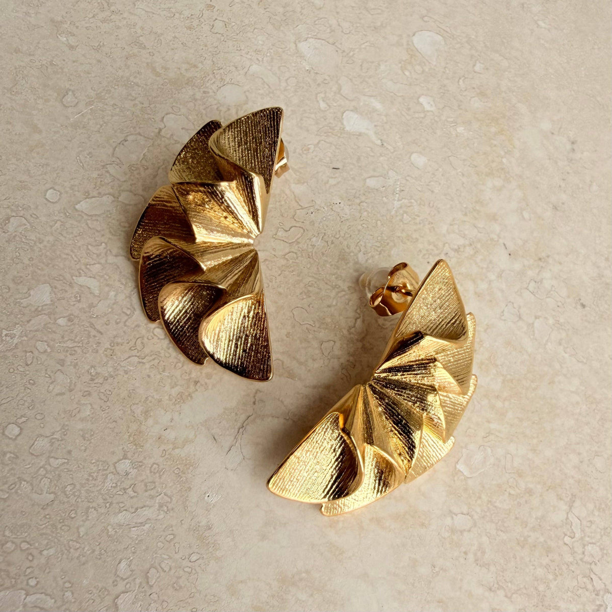 Sustainable everyday jewellery stack featuring ruffle earrings