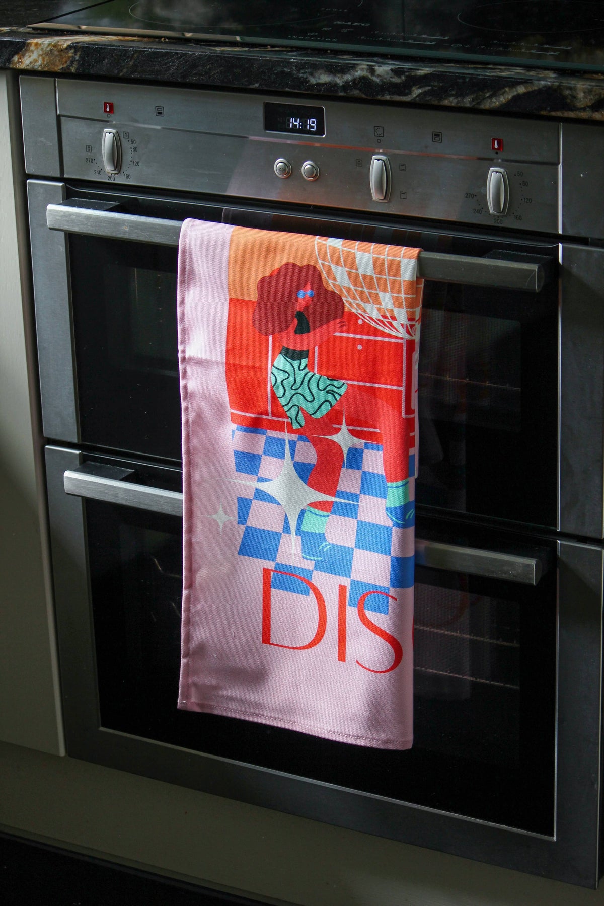 Eco-friendly cotton tea towel with colourful disco design