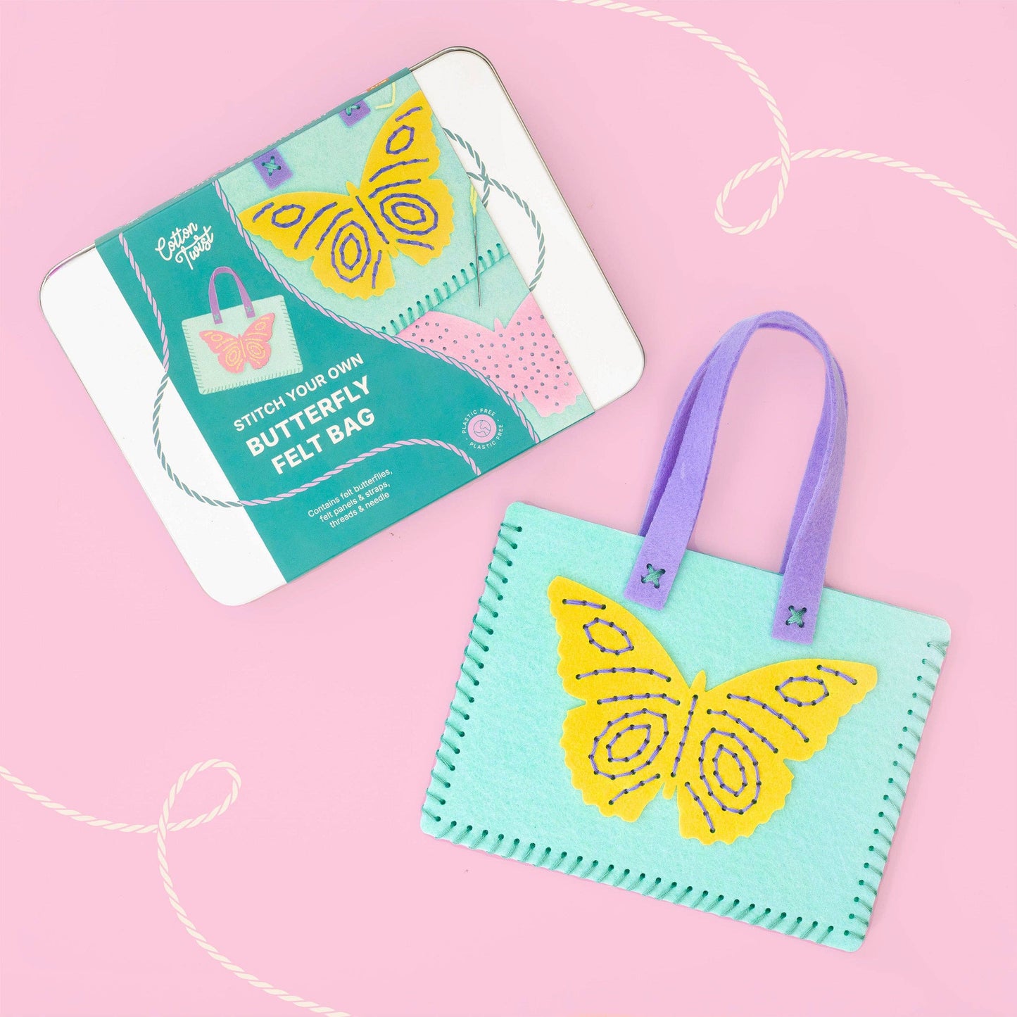 Completed children's handmade purple felt bag with stitched butterfly