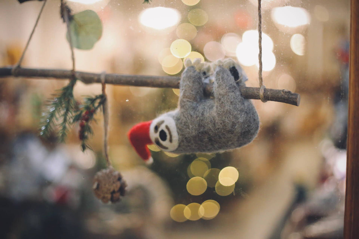 Handmade felt Christmas Sloth tree topper decoration by Felt So Good, sustainable wool with needle felted scarf and Christmas hat, biodegradable and eco-friendly