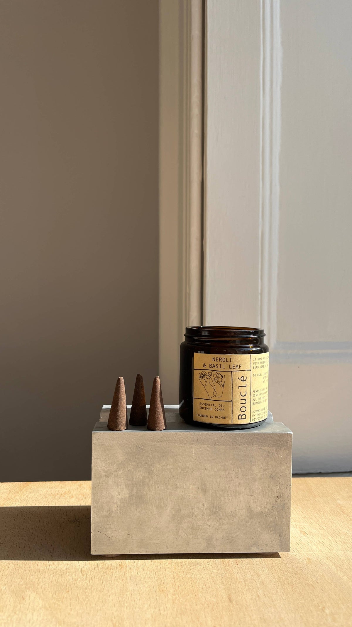 Neroli & Basil Leaf Incense Cones in amber glass jar