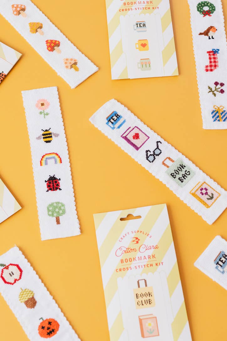 Finished DIY cross stitch bookmark inside a book