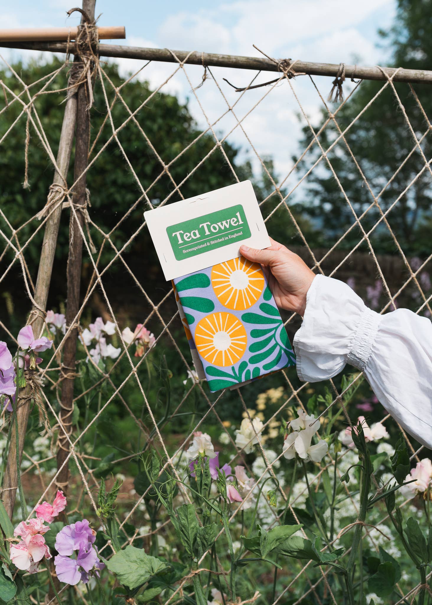 Vine floral design tea towel screenprinted on unbleached natural cotton by Studio Wald, with hanging loop.