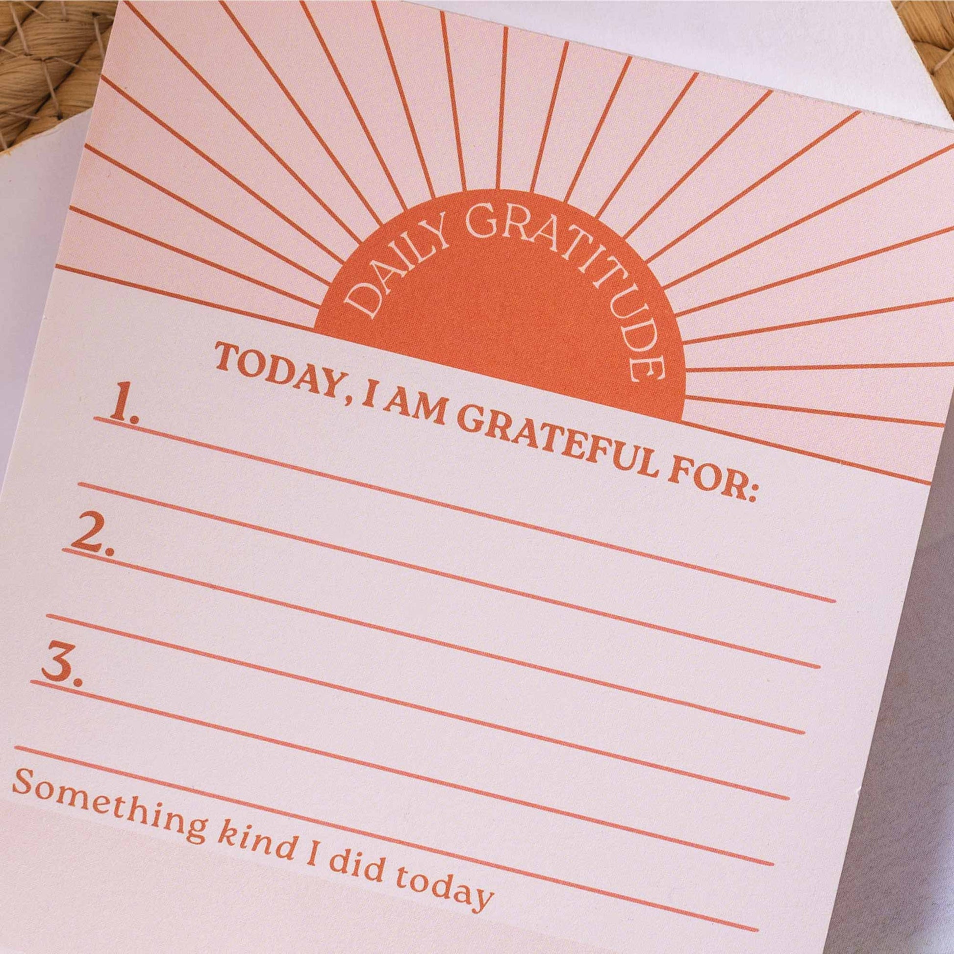 Close up of 50 tear-away pages on a daily gratitude pad