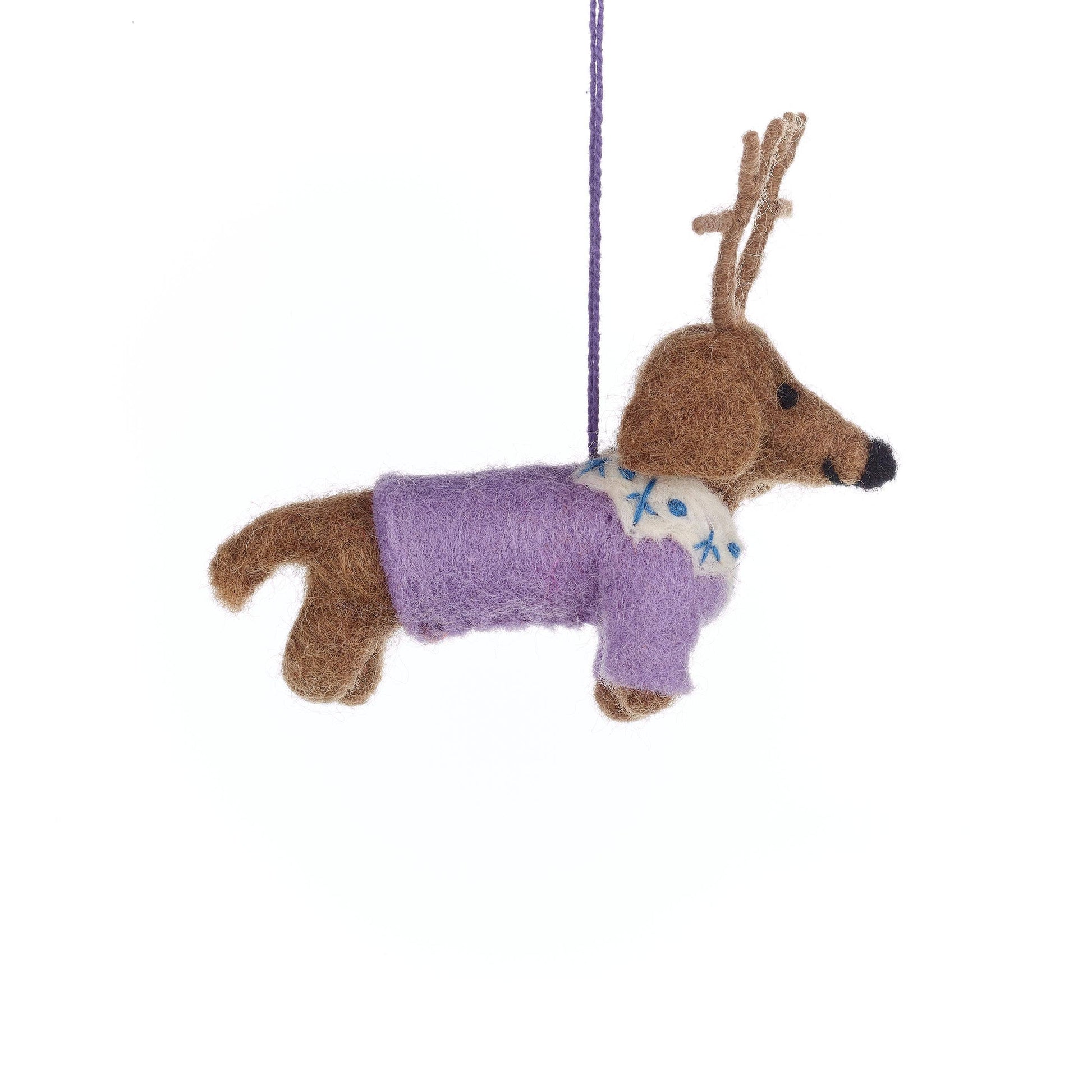 Rudy felt Dachshund Christmas decoration hanging on a Christmas tree