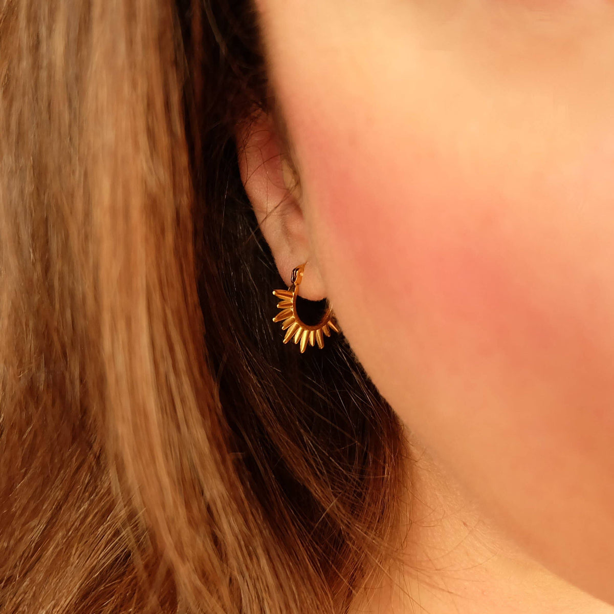 Close up of Gold Spike Sunrise Hoop Earrings