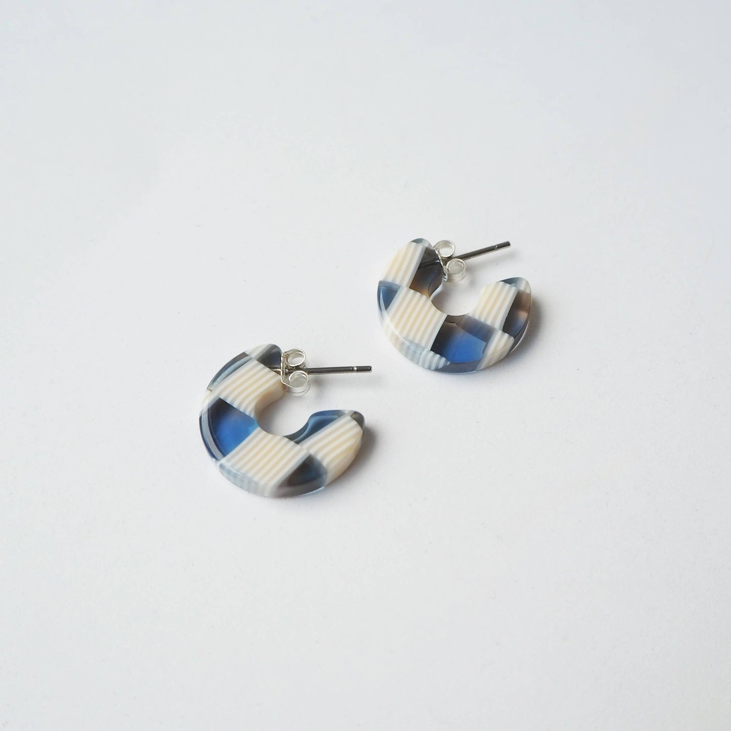 Sustainable acetate hoop earrings on branded earring card