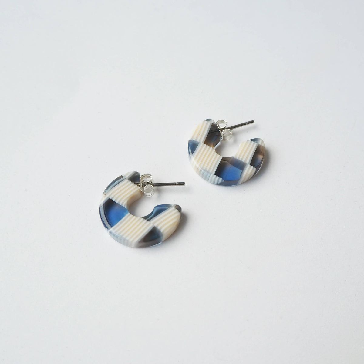 Sustainable acetate hoop earrings on branded earring card