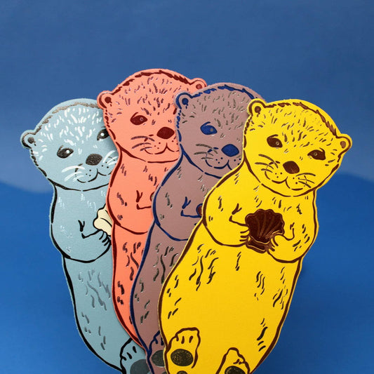 Handmade leather otter bookmark, embossed with Otterly Relaxed, British made by Ark Colour Design.