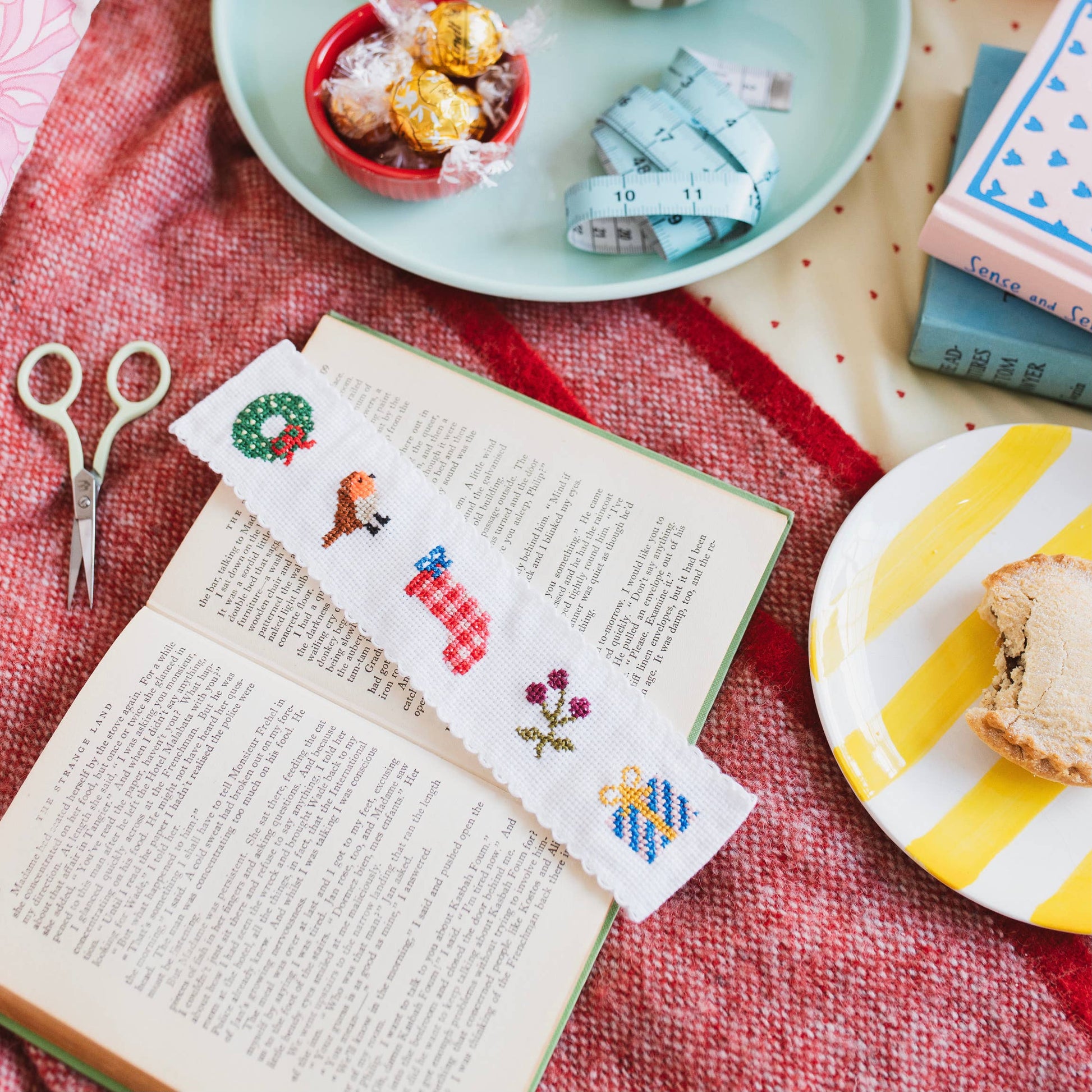 Contents of the Christmas bookmark cross stitch kit including threads and fabric