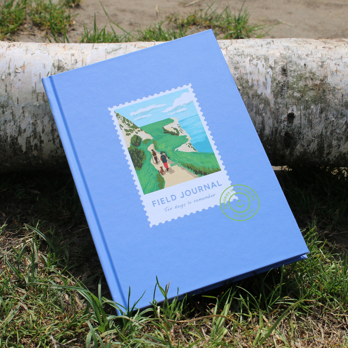Hiking Field Journal being used outdoors on a scenic trail