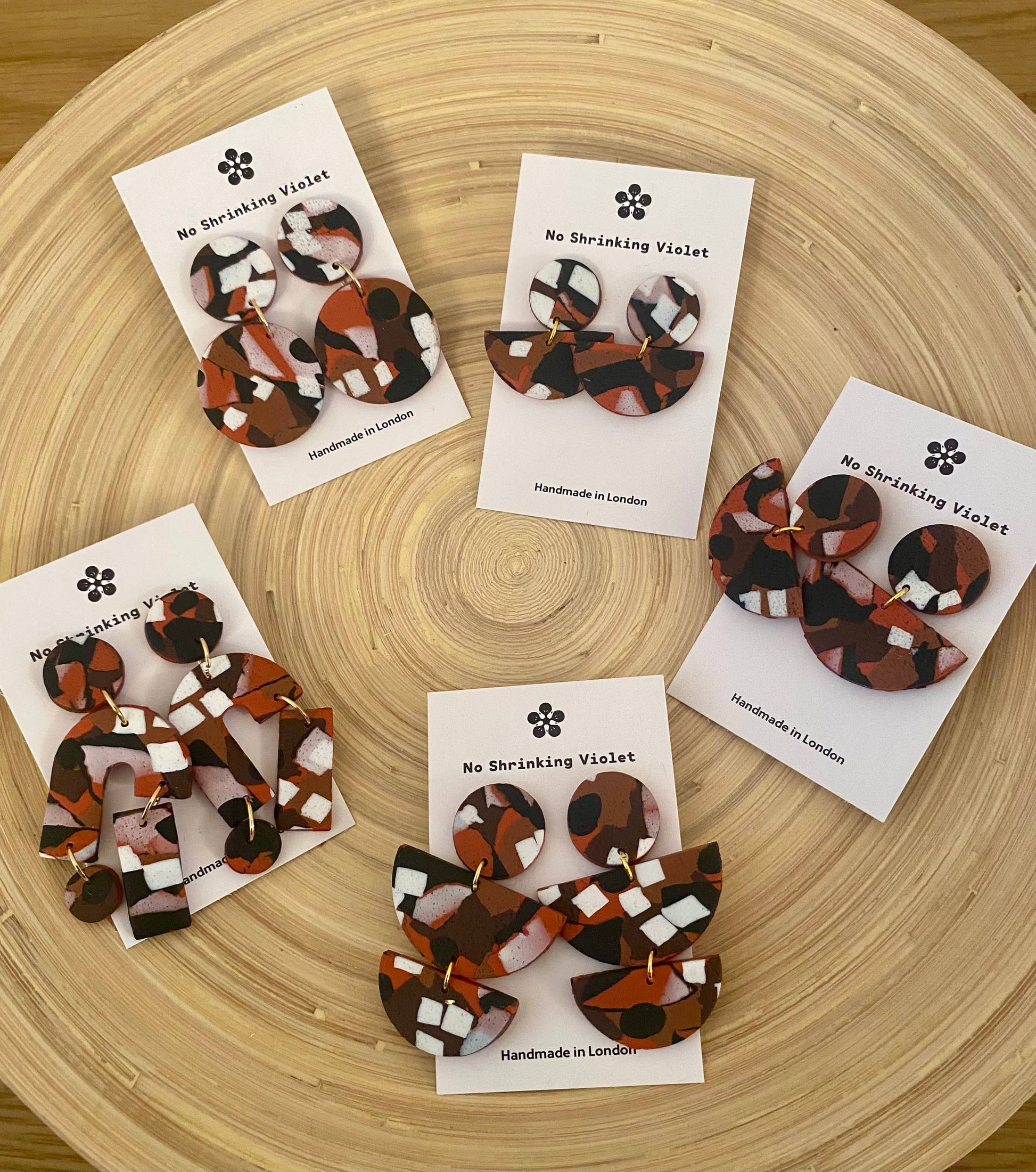 Close-up of Ngurra Medium Earring, intricate earthy texture, handmade polymer clay.