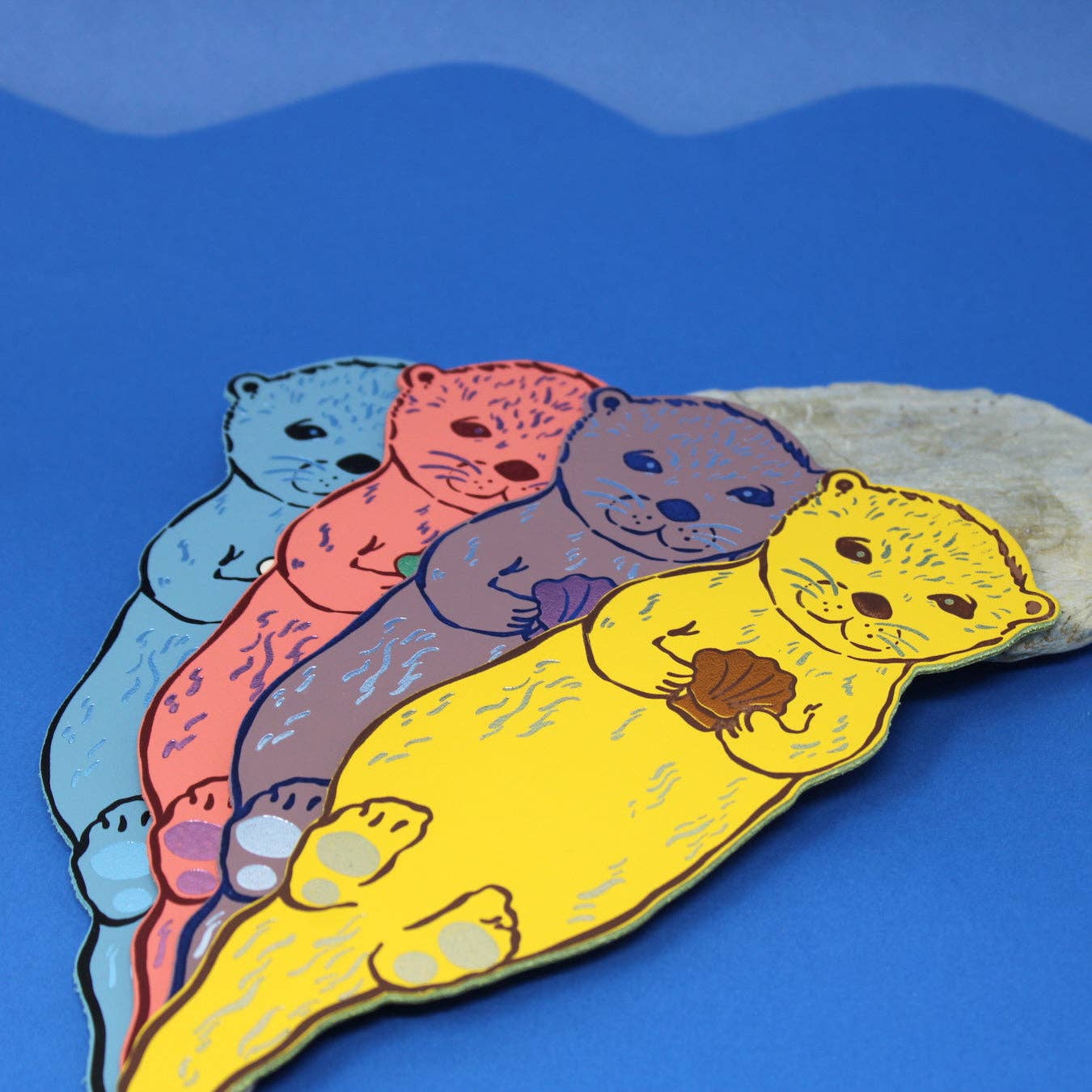 Handmade leather otter bookmark, embossed with Otterly Relaxed, British made by Ark Colour Design.