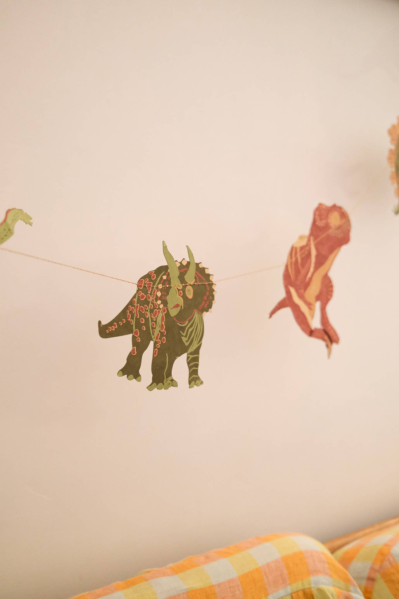 East End Press Dinosaur Garland with 10 colourful hand-printed dinosaurs on recycled paper, 3 metres long