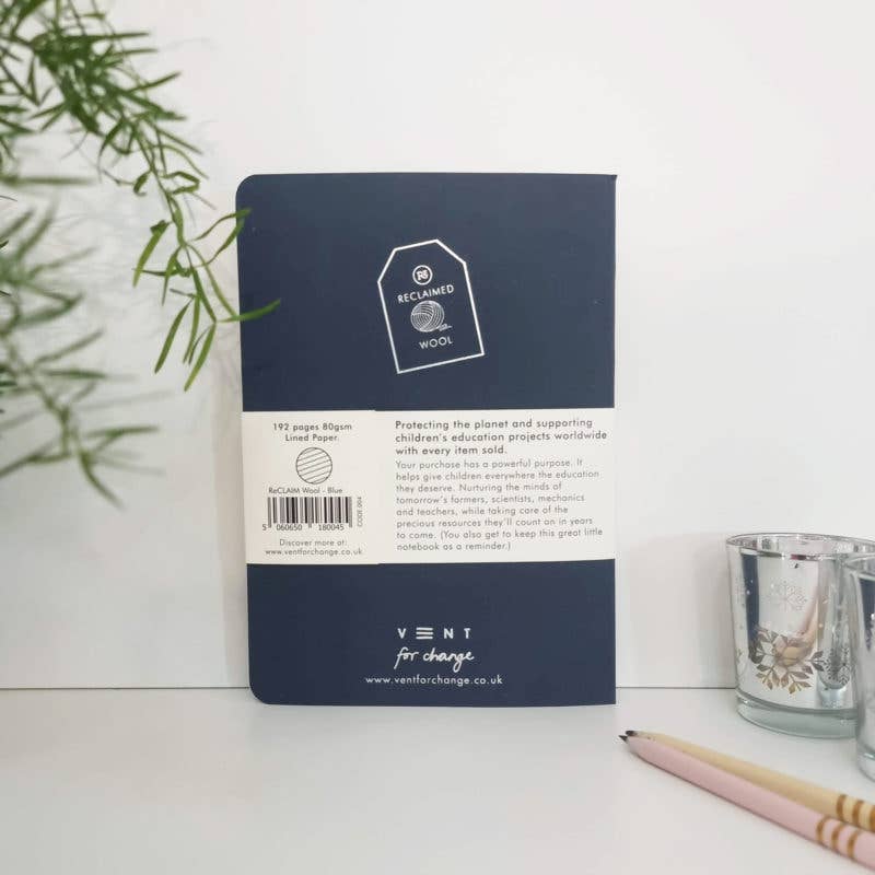 Open RECLAIM A5 Blue Notebook, showing lined 80gsm sustainably sourced paper and page marker