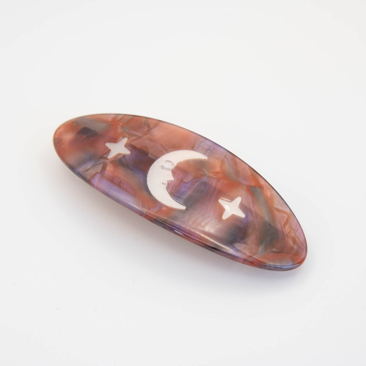 Night Sky barrette held in hand demonstrating 9cm size
