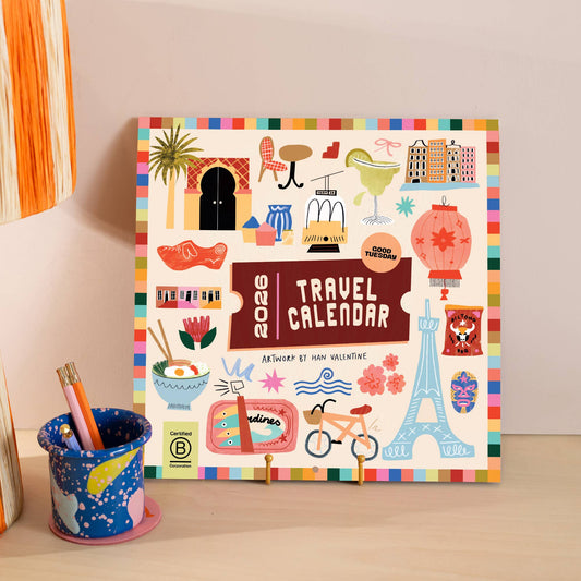 2026 Travel Wall Calendar by Good Tuesday—bold illustrated destinations by Han Valentine, retro colours, large date boxes, 100% recycled paper, UK made.