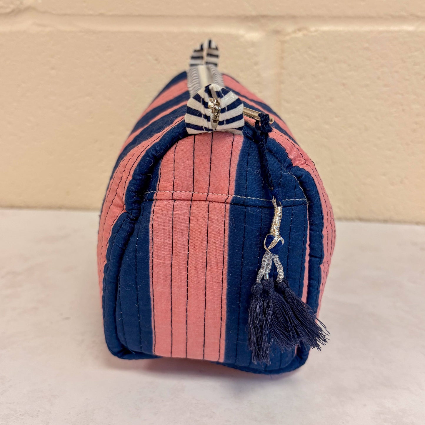 Large pink and navy stripe cosmetic bag with Constance & Denny label