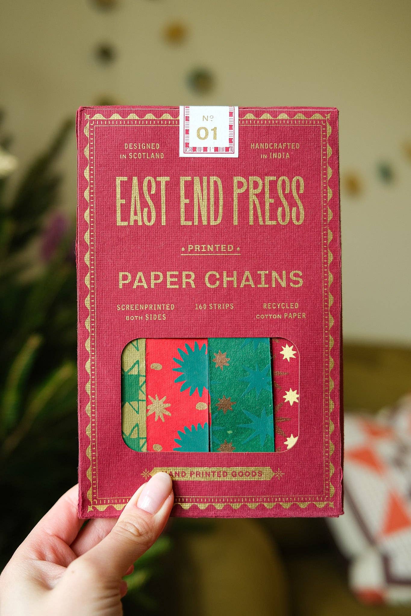Recycled festive paper chain strips, hand-printed double-sided, eco-friendly decoration kit.