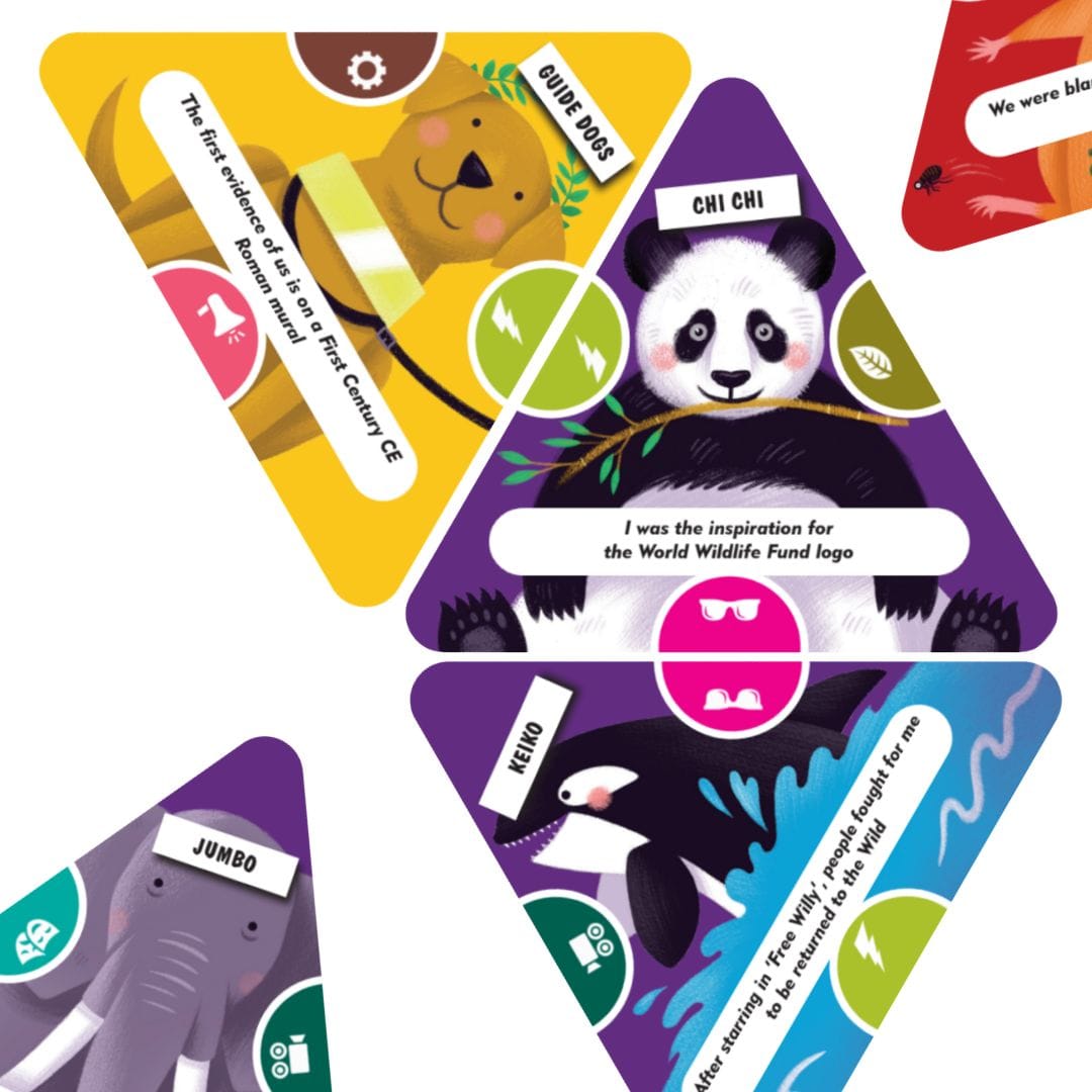 Triangular animal hero cards from A Little Slice of Animal History laid out on a table