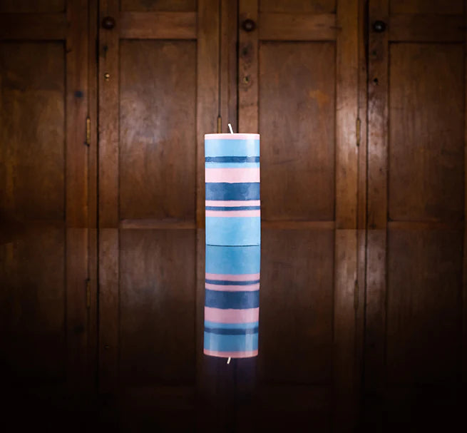 An eco, fair trade pillar candle, hand poured in bold stripes of British Colour Standard Rose Pink, Indigo Blue and Pompadour.
Size: 15cm tall x 7.5cm wide.
Eco and vegan candle wax.