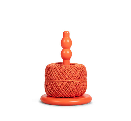 Close-up of the Orange Flame wooden twine holder and its jute ball.
