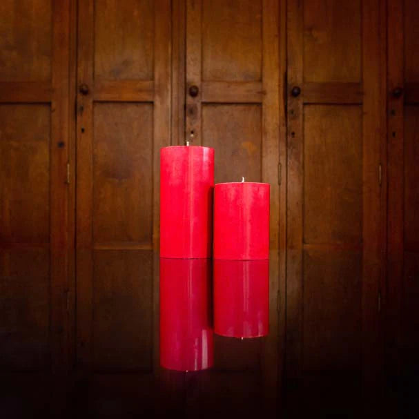 An eco, fair trade pillar candle, hand poured in British Colour Standard Guardsman Red.