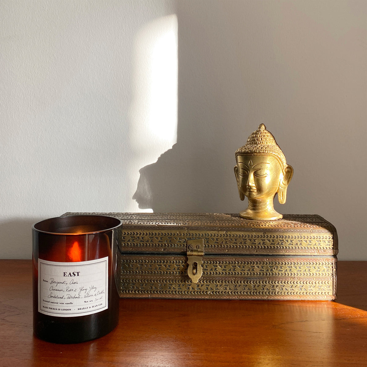 Close up of the East soy candle label and natural wax texture